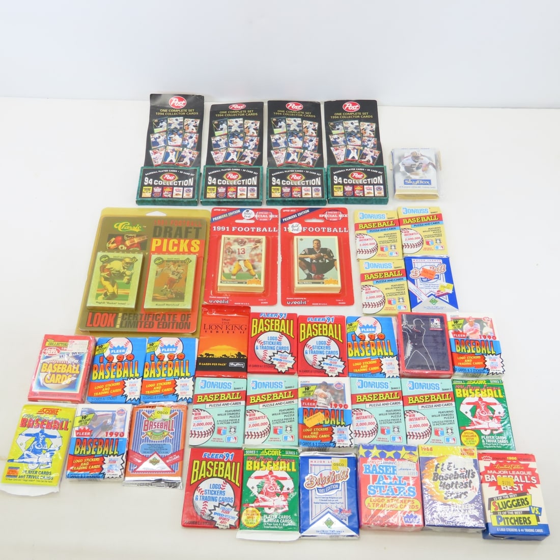 1990's Unopened Mixed Sports Card Packs: 1990's Unopened Mixed Sports Card Packs - LOT SIZE 8X6X6" 7 LB Photos are part of description. (Live Auctioneers only shows a max of 20 photos). Please ask questions and read terms & conditions before