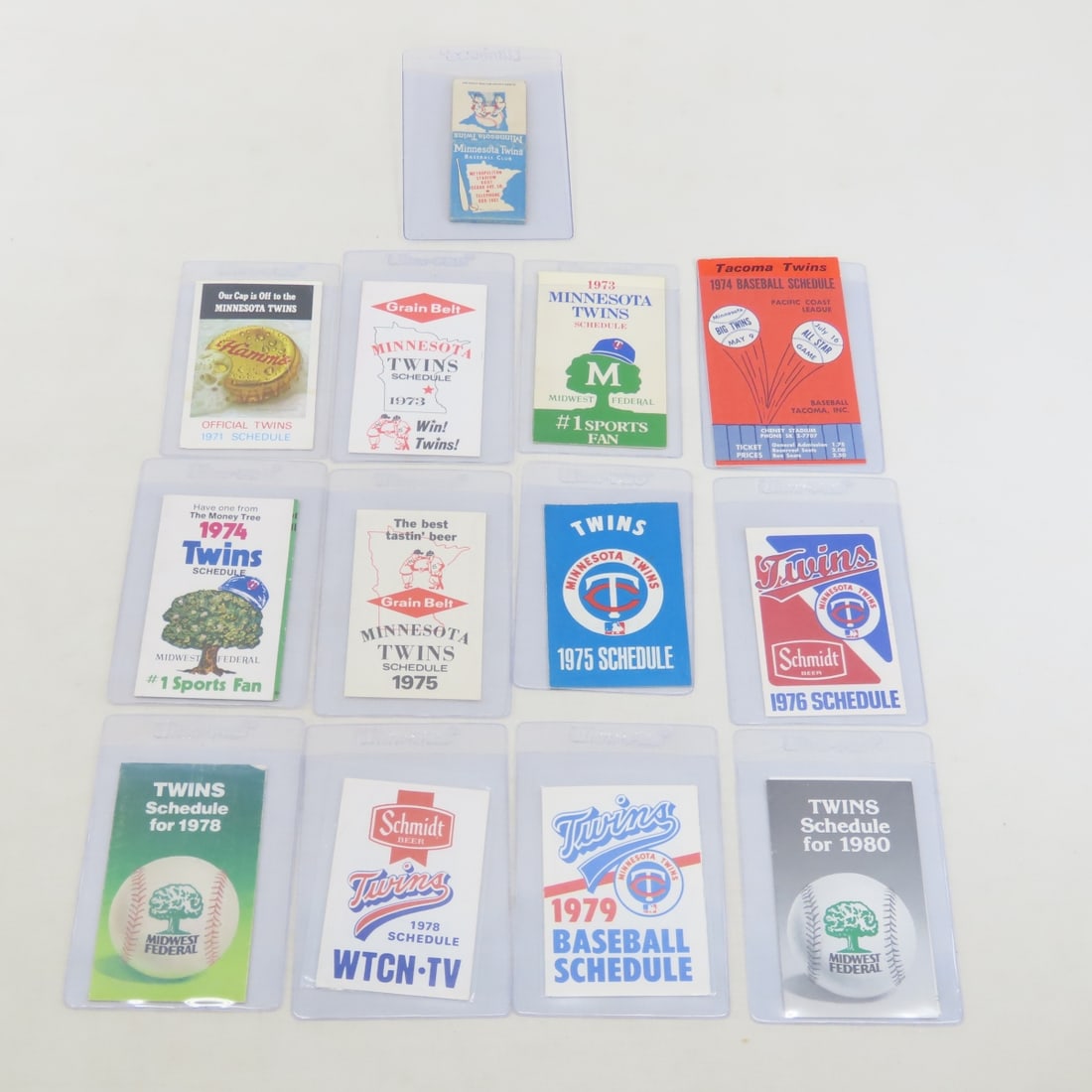 12 Vintage MN Twins Schedules & 1 Matchbook: 12 Vintage MN Twins Schedules & 1 Matchbook - Schedules from 1971 - 1980. LOT SIZE 4X4X4" 1 LB Photos are part of description. (Live Auctioneers only shows a max of 20 photos). Please ask questions