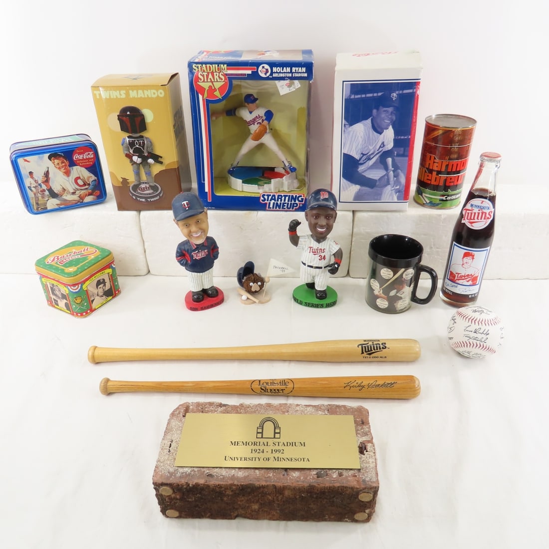 MN Twins & Other Sports Collectibles, Bobbleheads: MN Twins & Other Sports Collectibles, Bobbleheads - Souvenir mini bats, Memorial Stadium U of MN Brick, Harmon Killebrew Certicare Can, Rod Carew Coke Bottle full. LOT SIZE 18X14X10" 14 LB Photos are