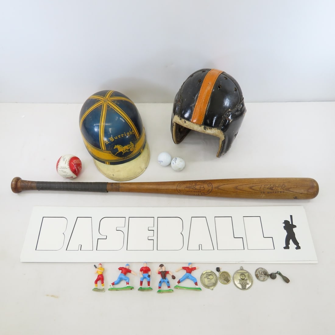 Ed Mathews Bat & Other Sport Collectibles: Ed Mathews Bat & Other Sport Collectibles - H & B No. 9 LEADER Ed Mathews Model 34" Wooden Baseball Bat, "BASEBALL" cut out for frame, vintage football helmet, vintage baseball cake toppers (some