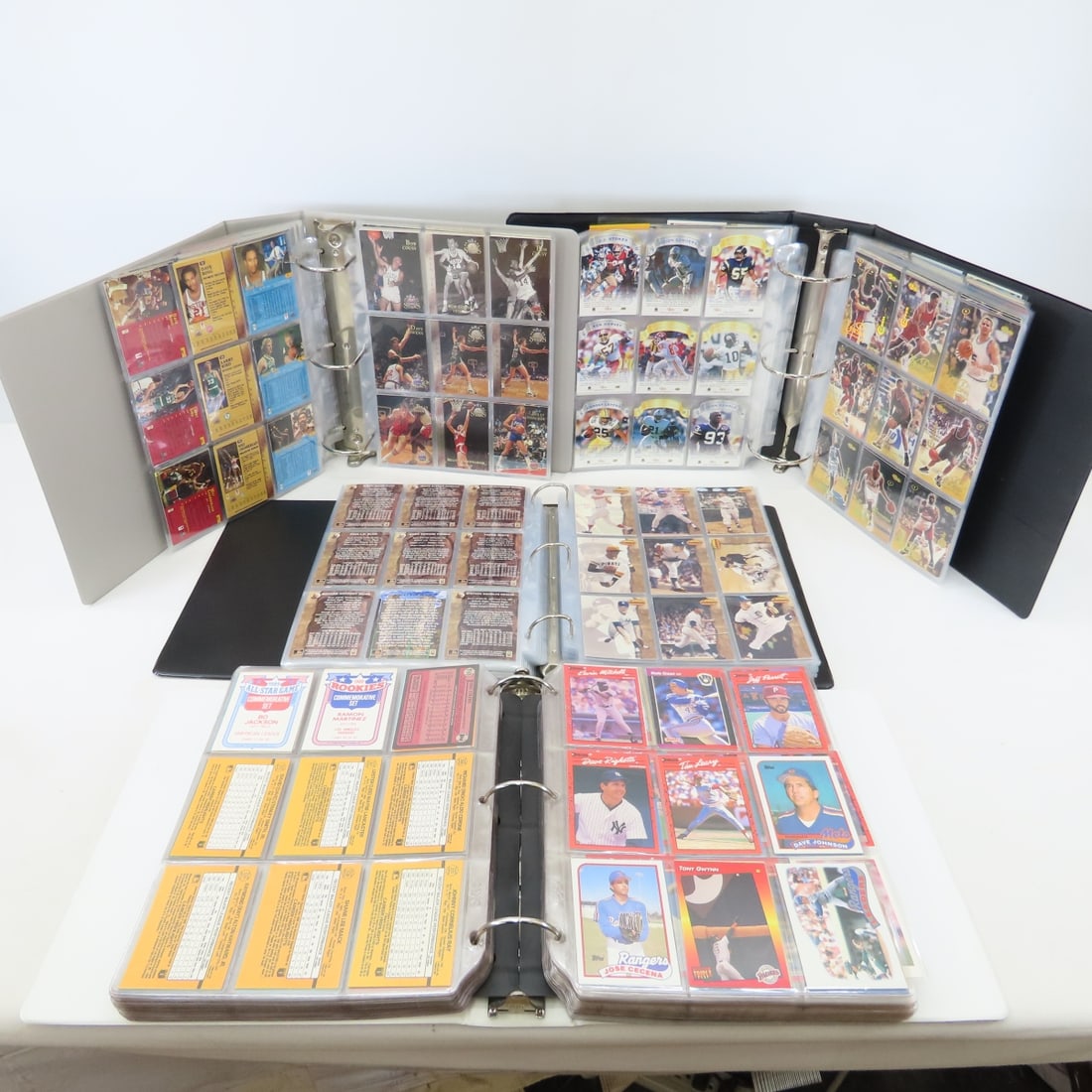 4 Binders 1980-90's Mixed Sports Cards: 4 Binders 1980-90's Mixed Sports Cards - some reprint cards. Lot size: 13x13x13", 25 lbs Photos are part of description. (Live Auctioneers only shows a max of 20 photos). Please ask questions and