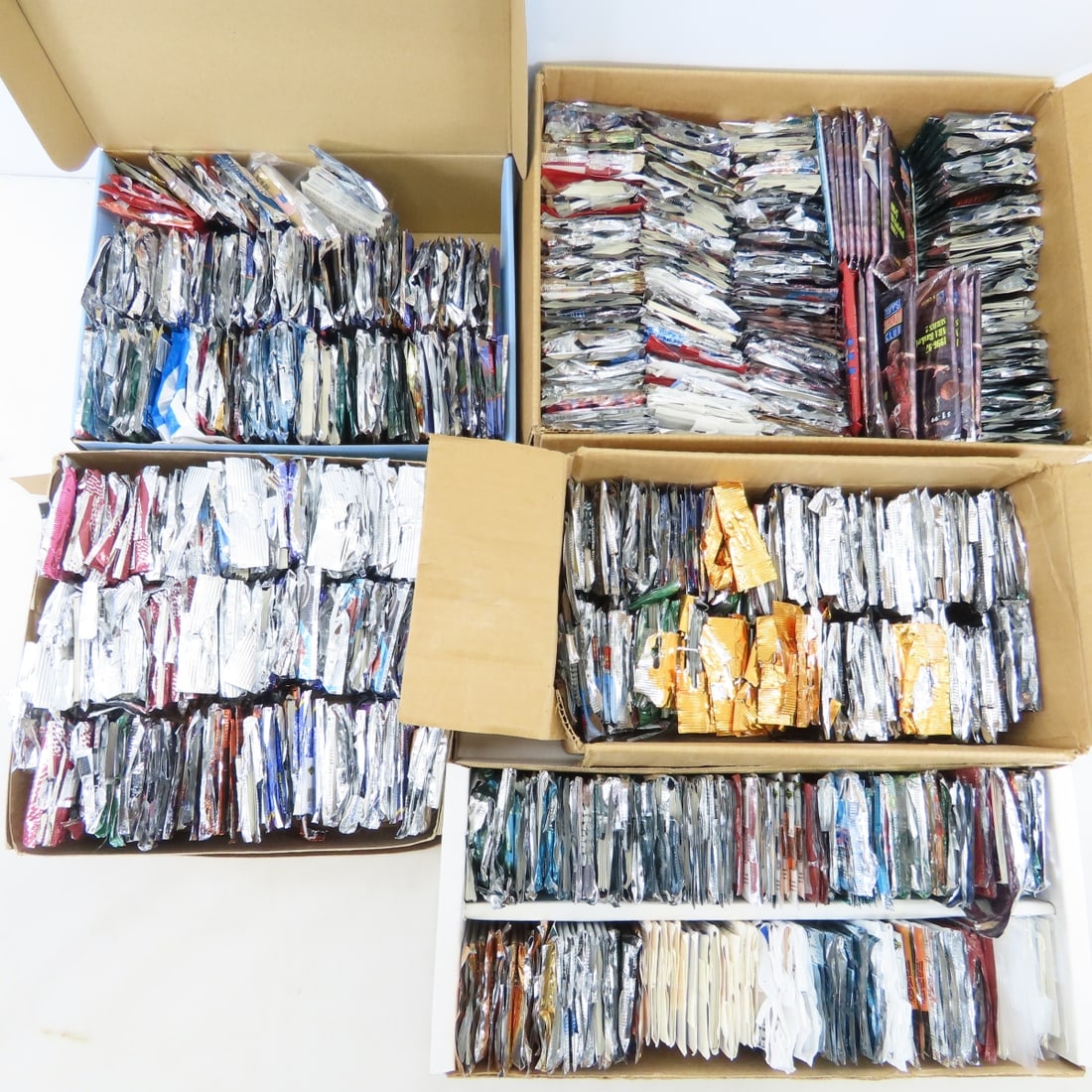 35 Pounds Open 1990's Mixed Sports Card Packs: 35 Pounds Open 1990's Mixed Sports Card Packs - all open packs- searched- not complete. Lot size: 18x18x18", 35 lbs Photos are part of description. (Live Auctioneers only shows a max of 20 photos).