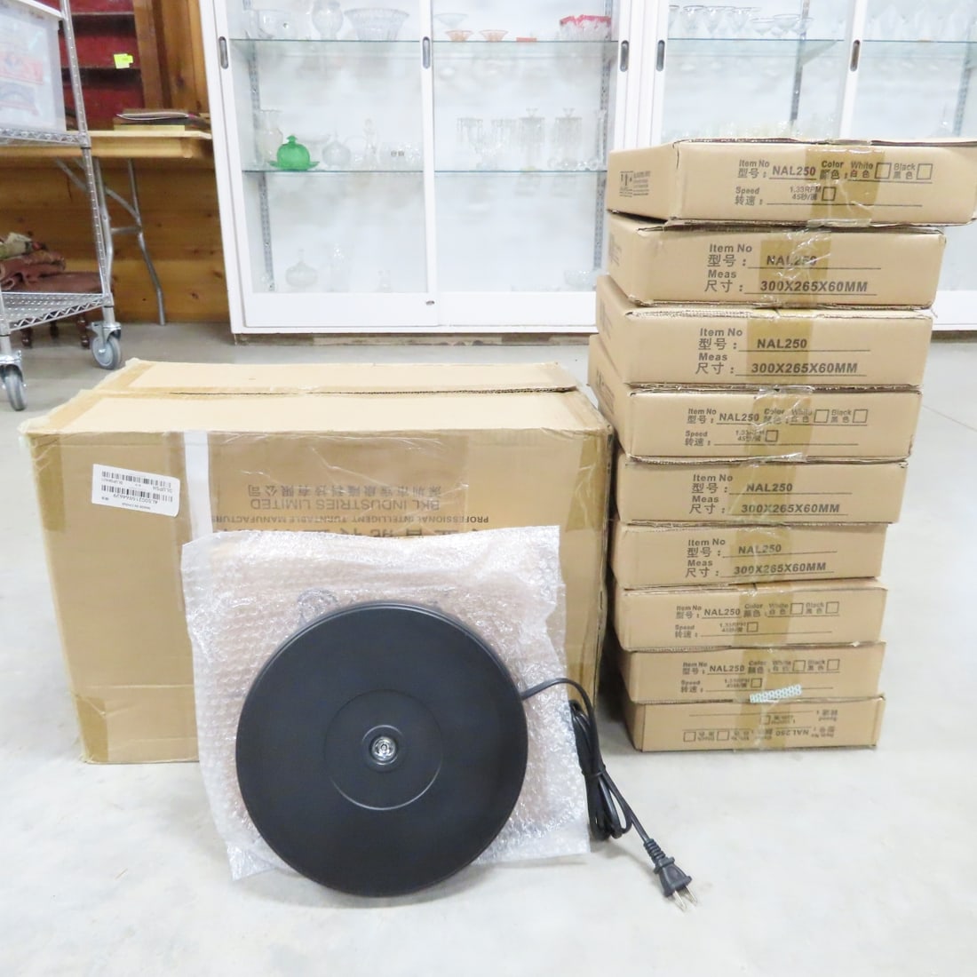 10 Black NAL250 Rotating 10" Display Stand w/LED: 10 Black NAL250 Rotating 10" Display Stand w/LED - New in Original Packaging, Steady Rotation, LED Light, Up to 20 lb Load Capacity. Lot Size: 22 x 13 x 15", 23 lbs Photos are part of description.