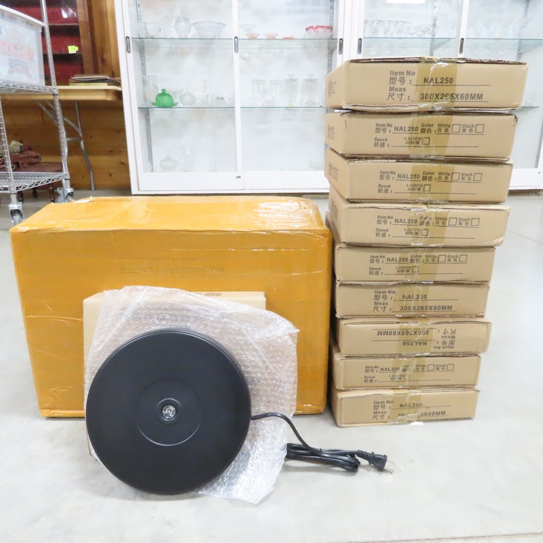 10 Black NAL250 Rotating 10" Display Stand w/LED: 10 Black NAL250 Rotating 10" Display Stand w/LED - New in Original Packaging, Steady Rotation, LED Light, Up to 20 lb Load Capacity. Lot Size: 22 x 13 x 15", 23 lbs Photos are part of description. (Li