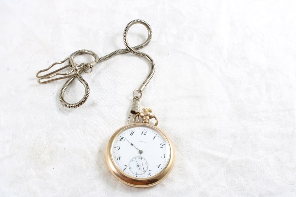 Agassiz 17 Jewel Pocket Watch 20 Yr Case Working: Agassiz 17 Jewel Pocket Watch 20 Yr Case Working - J R Wood & Son's 20 Year Case 17 Jewel, Serial #223830 Pocket Watch with Fob/Chain. Lot Size 3" x 3" x 1". 1 Lb. Photos are part of