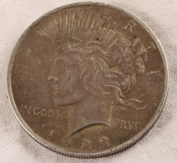 1923 Peace Silver Dollar: 1923 Peace Silver Dollar - Lot Size 3" x 2" x 1". 1 Lb. Photos are part of description (Live Auctioneers on displays a max of 20 photos -check other polatforms for all photos). Please ask questions