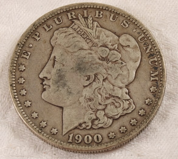 1900 O Morgan Silver Dollar: 1900 O Morgan Silver Dollar - Lot Size 3" x 2" x 1". 1 Lb. Photos are part of description (Live Auctioneers on displays a max of 20 photos -check other polatforms for all photos). Please ask
