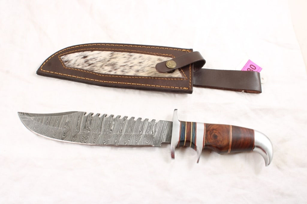 Damascus Bowie Knife 15" in Leather Sheath: Damascus Bowie Knife 15" in Leather Sheath - Lot Size 15" x 3" x 3". 1 Lb. Photos are part of description (Live Auctioneers on displays a max of 20 photos -check other polatforms for all photos).