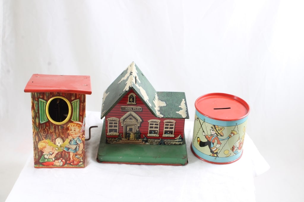 3 Tin Litho Mechanical Banks LBZ Germany, Ohio Art: 3 Tin Litho Mechanical Banks LBZ Germany, Ohio Art - LBZ Tin Mechanical Bird House Bank made in Germany, PS 23 School House Bank and Ohio Art Signed by Fern Bisel Peat Tin Litho Bank. Lot Size