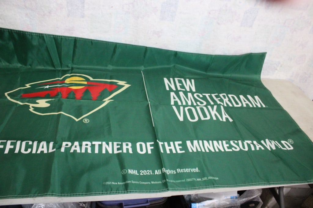Timber Wolves Amsterdam Vodka Advertising Banner: Timber Wolves Amsterdam Vodka Advertising Banner - Measures 3' x 5' . Lot Size 10" x 8" x 2". 1 Lb. Photos are part of description (Live Auctioneers on displays a max of 20 photos -check other