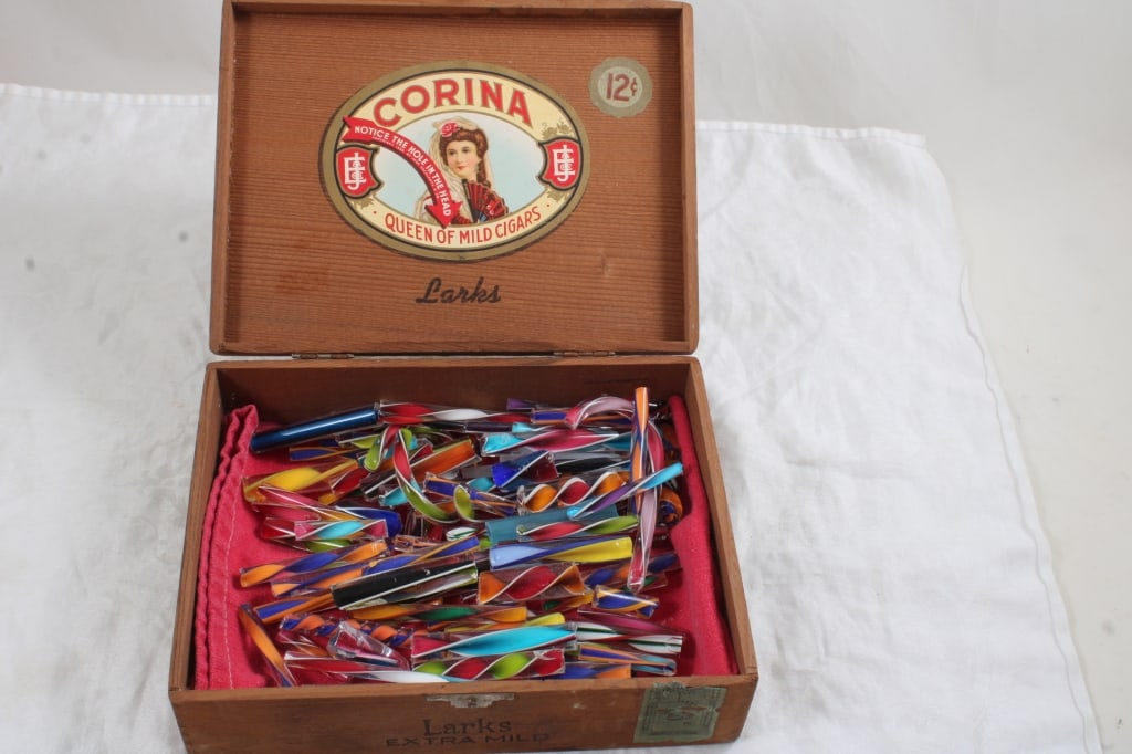 Happy Twisties Glass Canes in Cigar Box: Happy Twisties Glass Canes in Cigar Box - Corina Cigar Wood 12 Cent Cigar Box full of Glass Ends used in making Marbles. Lot Size 8" x 6" x 3. 2 Lbs. Photos are part of description (Live
