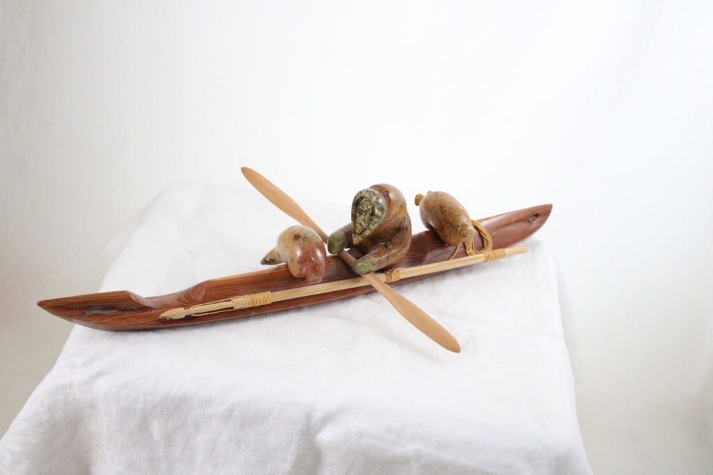 Inuit Wood Kayak w/Stone Hunter Artist Signed: Inuit Wood Kayak w/Stone Hunter Artist Signed - Hansel Komakhuk Artist Signed Stone Eskimo Inuit Carved wood Kayak. Lot Size 16" x 5" x 3". 2 Lbs. Photos are part of description (Live