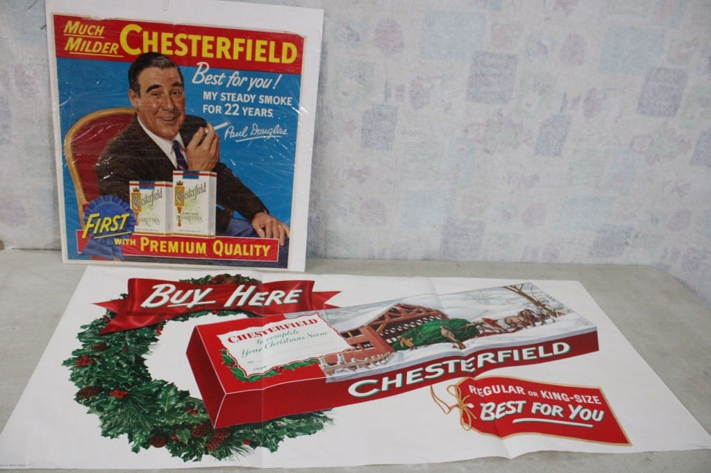 2 1950's Chesterfield Cigarette Poster Banner Ads: 2 1950's Chesterfield Cigarette Poster Banner Ads - One is 21" x 21" x 1" and the Chesterfield Christmas Ad is a 3 fold Litho USA and measures: 49" x 23" Lot Size 24" x 23" x 2". 2 Lbs.