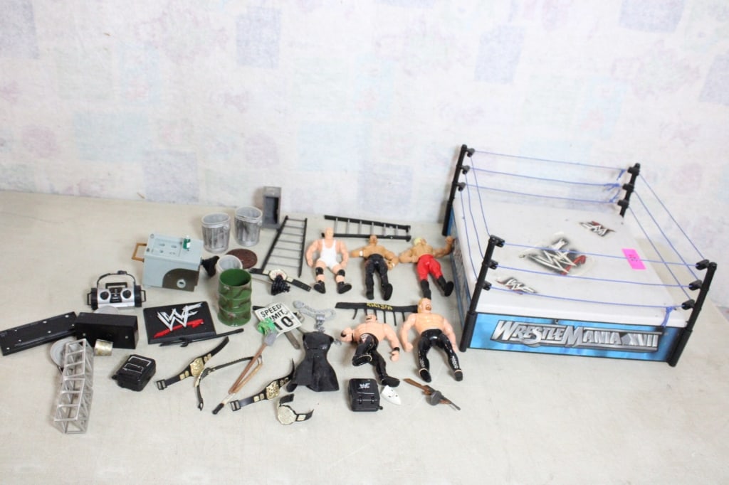 WWE WWFs Wrestle Mania Ring & 5 Wrestlers: WWE WWFs Wrestle Mania Ring & 5 Wrestlers - & Accessories. Titan Tron Jakks Pacific. Lot Size 15" x 15" x 10". 5 Lbs. Photos are part of description (Live Auctioneers on displays a max of 20