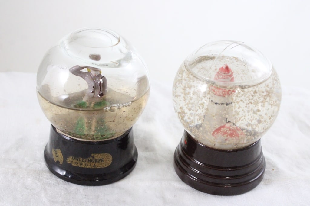 WW2 WAC Soldier Snow Globe Crystal Works & More: WW2 WAC Soldier Snow Globe Crystal Works & More - Two Harbors Minnesota Lighthouse Snow Globe both WW2 Era. Lot Size 6" x 4" x 4". 2 Lbs. Photos are part of description (Live Auctioneers on