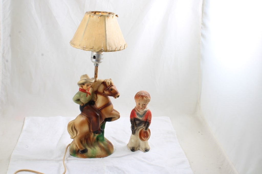 Chalk Ware Cowboy on Horse Lamp Rawhide Shade: Chalk Ware Cowboy on Horse Lamp Rawhide Shade - and Young Cowboy Chalk Ware Carnival Prize. Lot Size 14" x 8" x 10". 4 Lbs. Lamp Works. Photos are part of description (Live Auctioneers on