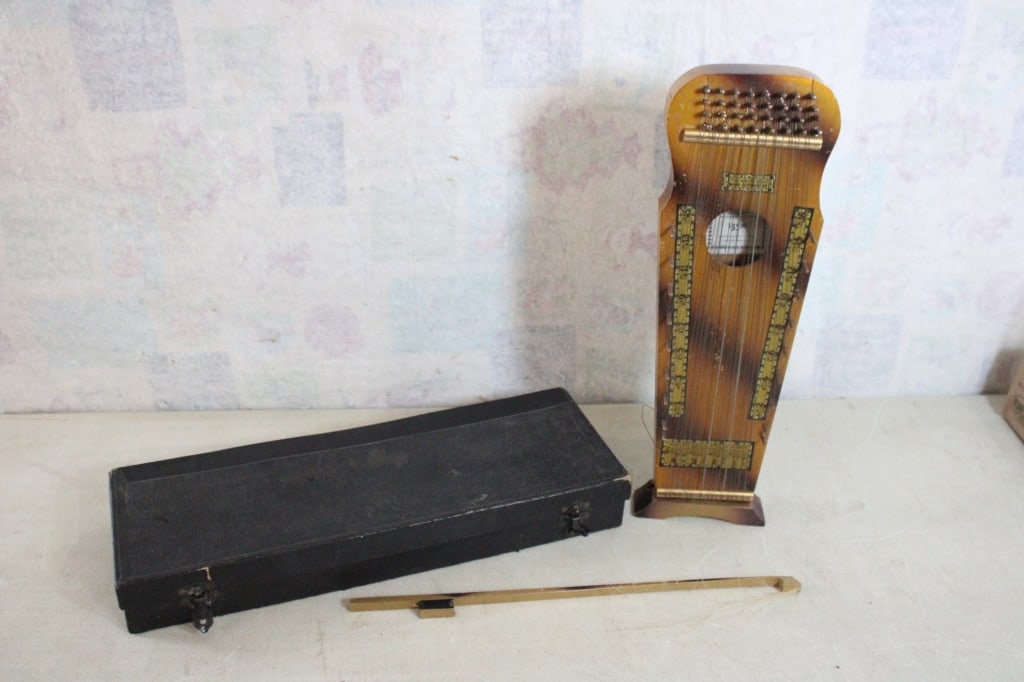 Marx Violin Uke in Case and some Music Sheets: Marx Violin Uke in Case and some Music Sheets - Lot Size 21" x 8" x 3". 5 Lbs. Missing a couple of strings and horse hair on the bow. Case shows a lot of wear & there has been a repair on the