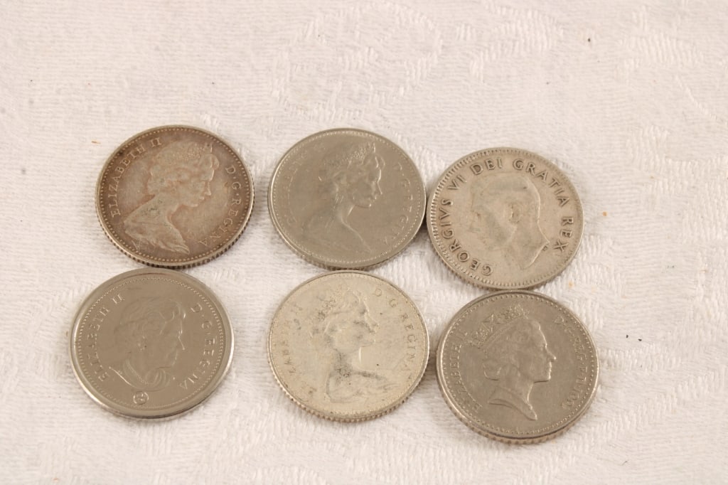 6 Vintage Canadian 10 Cent Silver Coins: 6 Vintage Canadian 10 Cent Silver Coins - 2 are Centennial 1867-1967. Lot Size 2" x 2" x 1". 1 Lbs. Photos are part of description (Live Auctioneers on displays a max of 20 photos -check other
