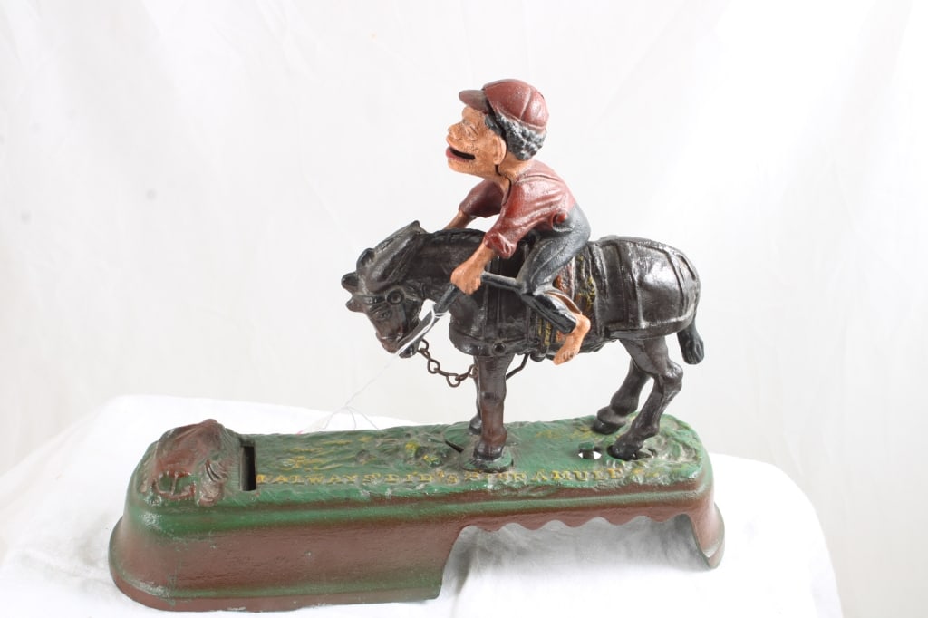 Book of Knowledge Cast Iron Mechanical Bank: Book of Knowledge Cast Iron Mechanical Bank - "I Always Dis's S'pise A Mule". Lot Size 10" x 7" x 3". 4 Lbs. Photos are part of description (Live Auctioneers on displays a max of 20 photos -check othe
