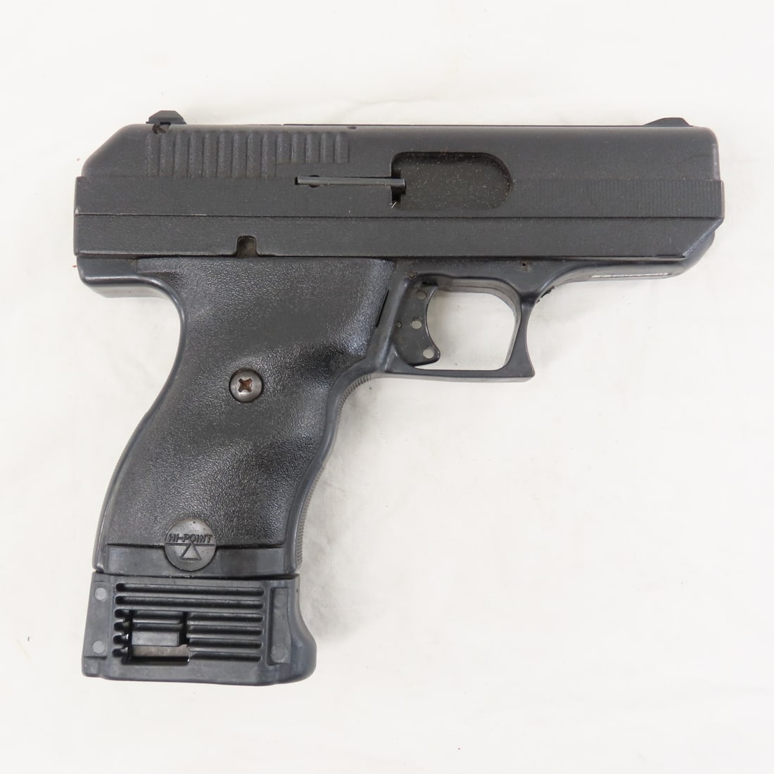 Hi-Point Model C9 9mm Luger Pistol: Hi-Point Model C9 9mm Luger Pistol - SN# P1204420, 3.5" barrel, 3 point red dot sights, extended 10 round magazine, black synthetic grips. FFL transfer required, please know local laws before