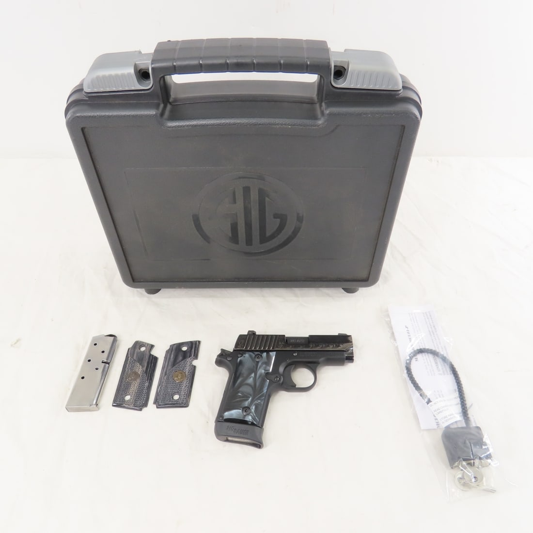Sig Sauer P238 Black Pearl Pistol .380 ACP: Sig Sauer P238 Black Pearl Pistol .380 ACP - SN# 27C021620, engraved and polished nitron slide, slim micro compact frame, and Sig Lite night sights. 2.7" barrel, 2 6 round magazines, Pachmayr