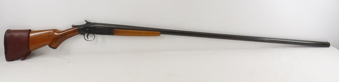 Long Tom 12 GA Top Break Shotgun: Long Tom 12 GA Top Break Shotgun - NVSN on receiver, 40.5" Genuine armory steel choke barrel marked 87111, plain wood forearm marked 167 (not original), checkered wood pistol grip stock has crack from
