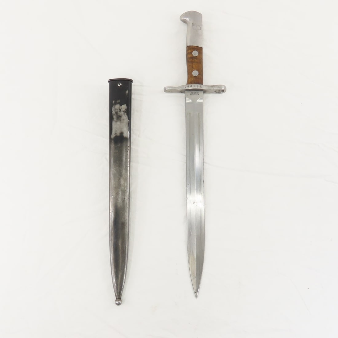 Elsener Schwyz 1918 bayonet with scabbard: Elsener Schwyz 1918 bayonet with scabbard - Blade Measures 11.75", 16.75" overall. Lot Size 18x2x2" 4 LB All information and photos are intended to be as accurate as possible, but errors are possible.
