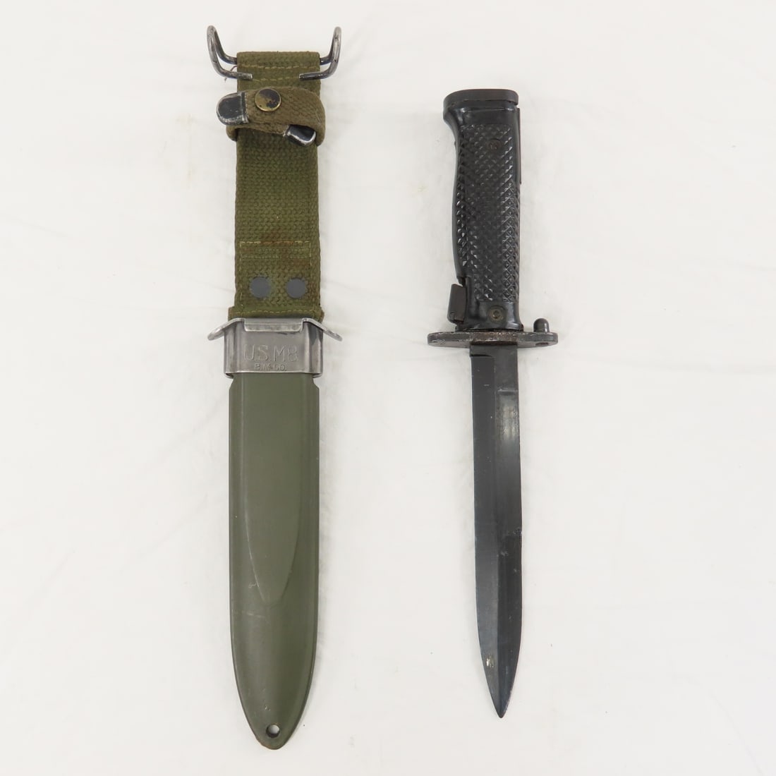 U.S. M8 Bayonet with scabbard & Frog: U.S. M8 Bayonet with scabbard & Frog - Lot Size 14x3x3" 5 LB All information and photos are intended to be as accurate as possible, but errors are possible. No item may be returned or refused based on