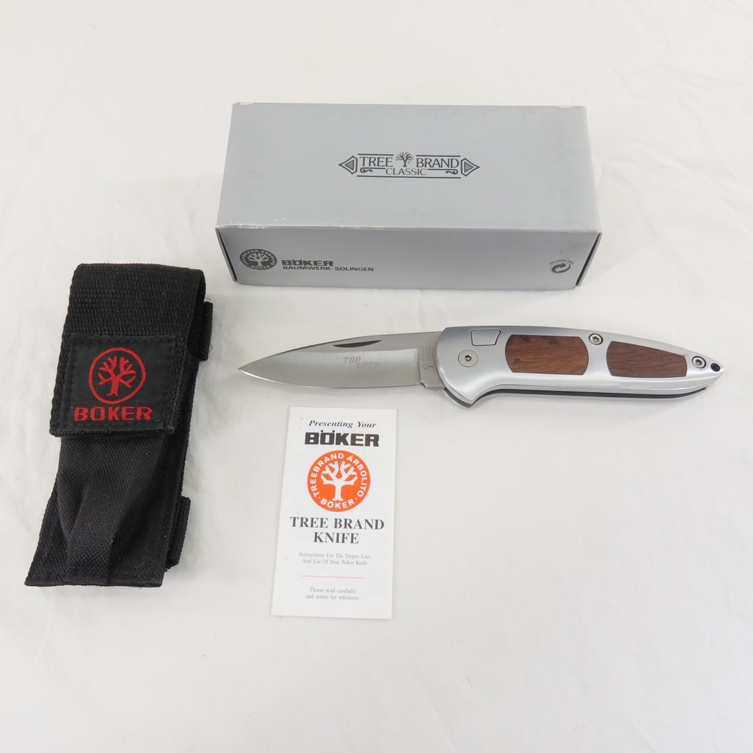 Boker Top Lock Thuya Wood 701 Pocket Knife: Boker Top Lock Thuya Wood 701 Pocket Knife - Tree Brand Classic With Sheath & Box, Lot Size 7x3x2" 1 LB All information and photos are intended to be as accurate as possible, but errors are