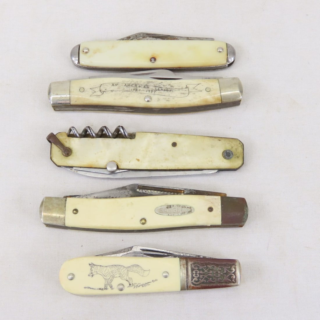 5 Vintage Folding Pocket Knives, Schrade & Others: 5 Vintage Folding Pocket Knives, Schrade & Others - Schrade, Sargent, Sports Afield & others. Lot Size: 4 x 4 x 2", 1 lb All information and photos are intended to be as accurate as possible, but erro