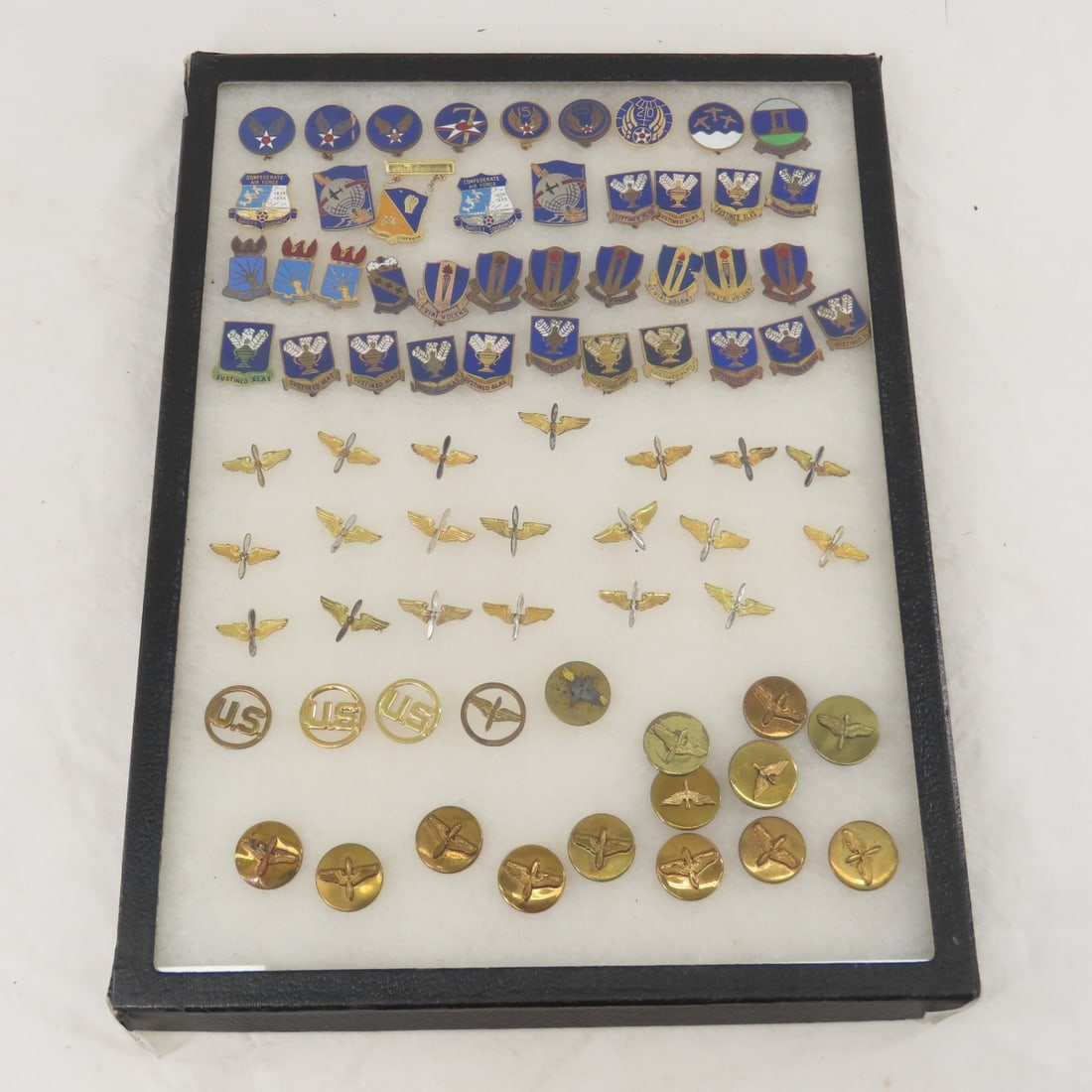 Collection of Military Insignia Pins in Riker Case: Collection of Military Insignia Pins in Riker Case - 16 x 12 x 1", 3 lbs All information and photos are intended to be as accurate as possible, but errors are possible. No item may be returned or