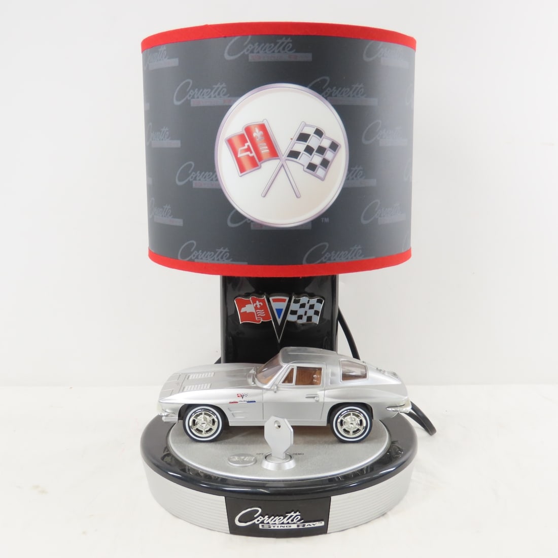 King America 1963 Corvette Stingray Table Lamp: King America 1963 Corvette Stingray Table Lamp - Tested, Working. 1:20 Scale Corvette Stingray Table Lamp. Lights Up, Engine Purrs. 15.5" tall. Lot Size: 16 x 12 x 10", 4 lbsPhotos are part of