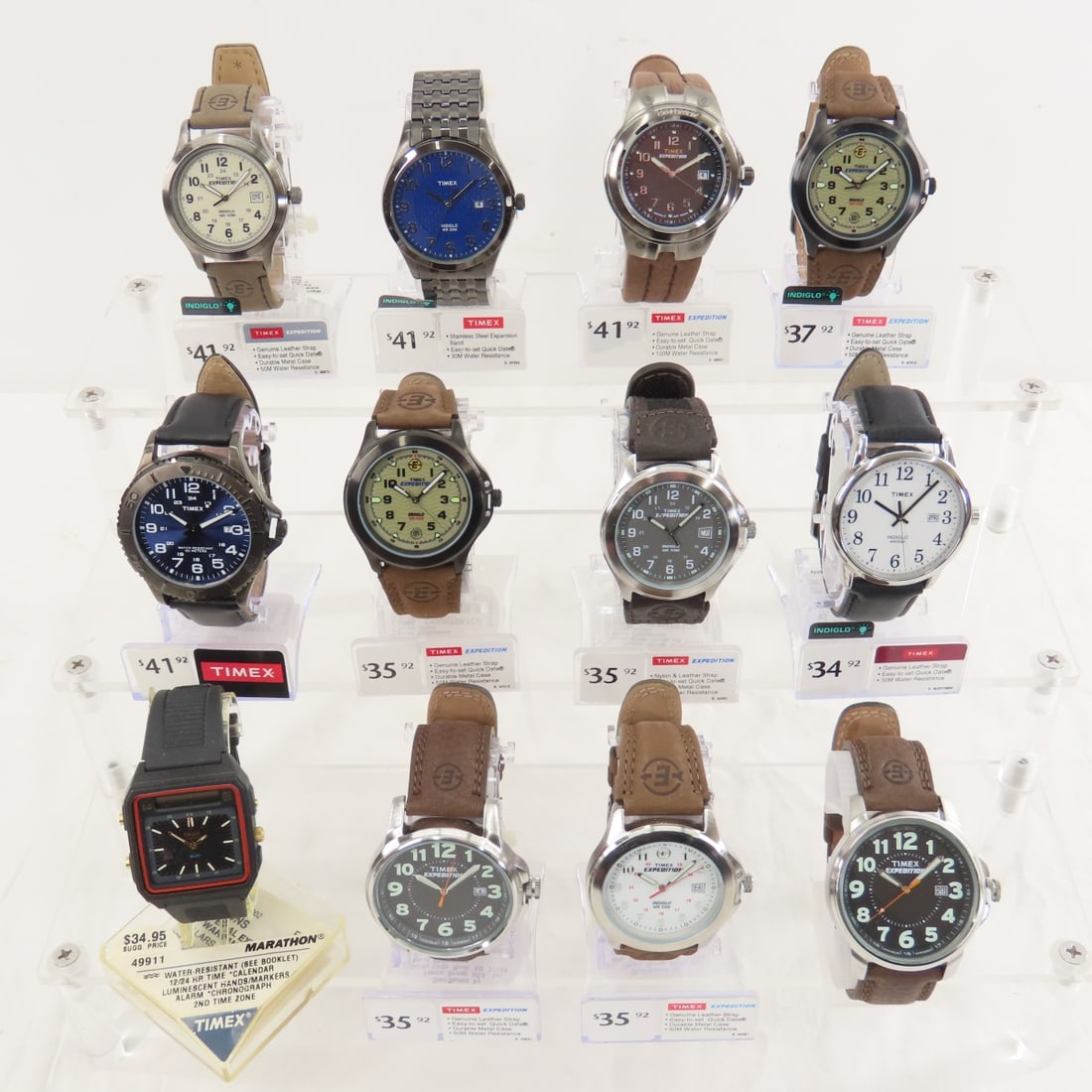 12 New Timex Watches, Expedition, Indiglo & more: 12 New Timex Watches, Expedition, Indiglo & more - 12 on retail display stands with price tags. None are running, all likely need new batteries. Lot Size 10x8x4" 2 LBPhotos are part of description, pl