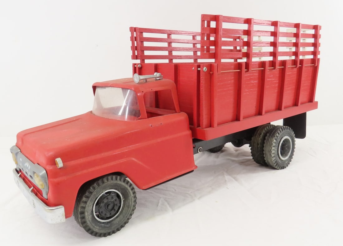 Custom Pressed Steel Tonka Livestock Truck: Custom Pressed Steel Tonka Livestock Truck - pressed steel cab- broken mirrors, custom wood stakes- hinged to fold down, LOT SIZE: 18x7x7x4 LBS All information and photos are intended to be as