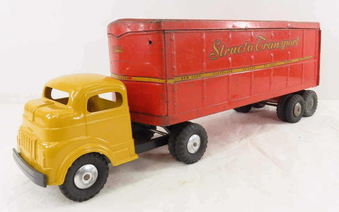 Restored Structo Tractor & Original Trailer: Restored Structo Tractor & Original Trailer - pressed steel, LOT SIZE: 16x11x8", 6 LBS All information and photos are intended to be as accurate as possible, but errors are possible. No item may be re