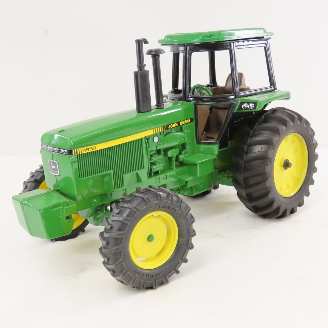 ERTL John Deere 4955 MFWD Tractor w/ Cab: ERTL John Deere 4955 MFWD Tractor w/ Cab - stamped 1259, 1/16 diecast, LOT SIZE:15x7x8" 4 LBSAll information and photos, which are part of the description) are intended to be as accurate as possible, 