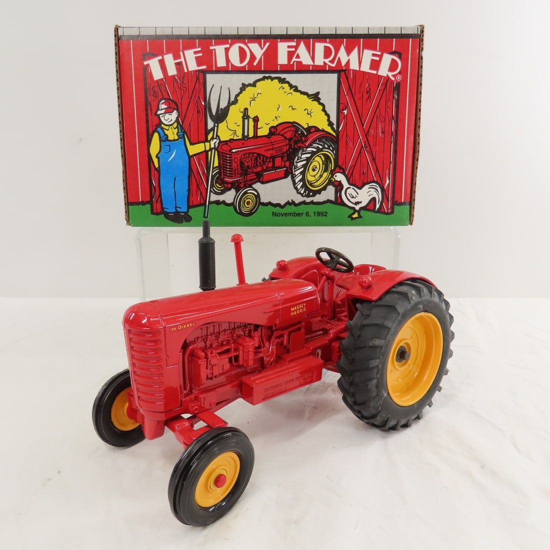 ERTL Massey-Harris 55 Tractor 1992 Toy Farmer: ERTL Massey-Harris 55 Tractor 1992 Toy Farmer - WF diesel, National Toy Farm Show 11-6-92, 1/16 diecast with box, LOT SIZE: 10x7x6" 4 LBSAll information and photos, which are part of the description) 