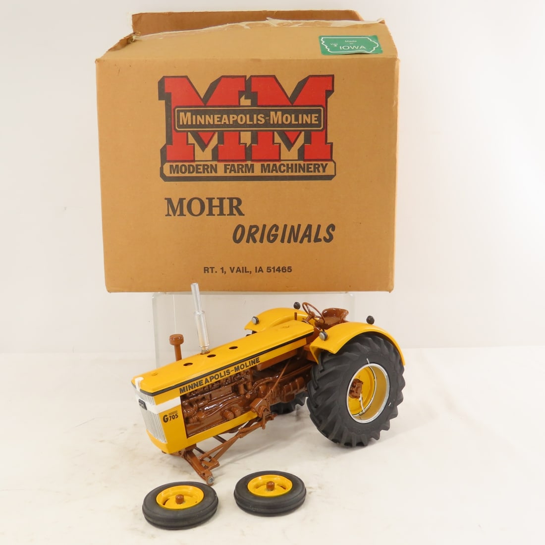 Mohr M-M Brown Belly G705 WF Tractor with Box: Mohr M-M Brown Belly G705 WF Tractor with Box - Minneapolis-Moline, front wheels have broken off- easy repair, 1/16 diecast, LOT SIZE: 13x10x9" 4.5 LBSAll information and photos, which are part of