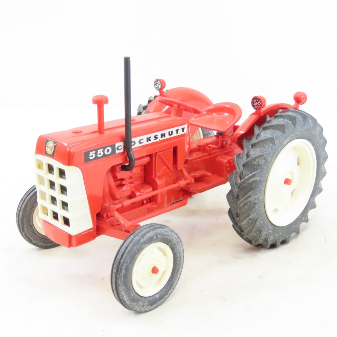 Yoder's Cockshutt 550 Plastic Tractor: Yoder's Cockshutt 550 Plastic Tractor - marked New Paris, IN. 1/16 model, LOT SIZE: 7x5x5" 1 lbAll information and photos, which are part of the description) are intended to be as accurate as possible