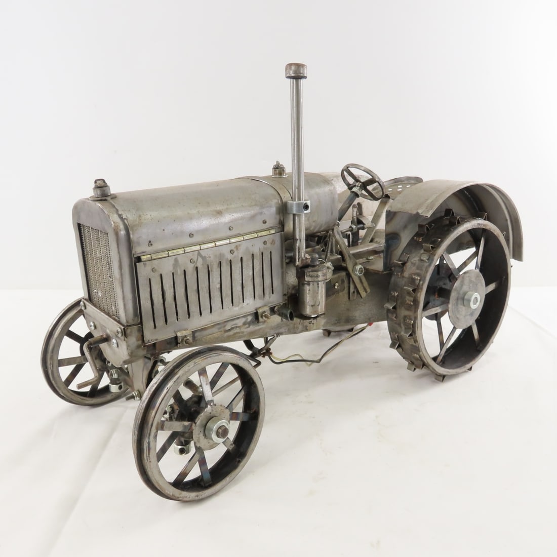 Scratch Built 1/8 Metal Tractor with Motor: Scratch Built 1/8 Metal Tractor with Motor - electric motor- not working, LOT SIZE: 19x10x13" 14 LBS All information and photos, which are part of the description) are intended to be as accurate as