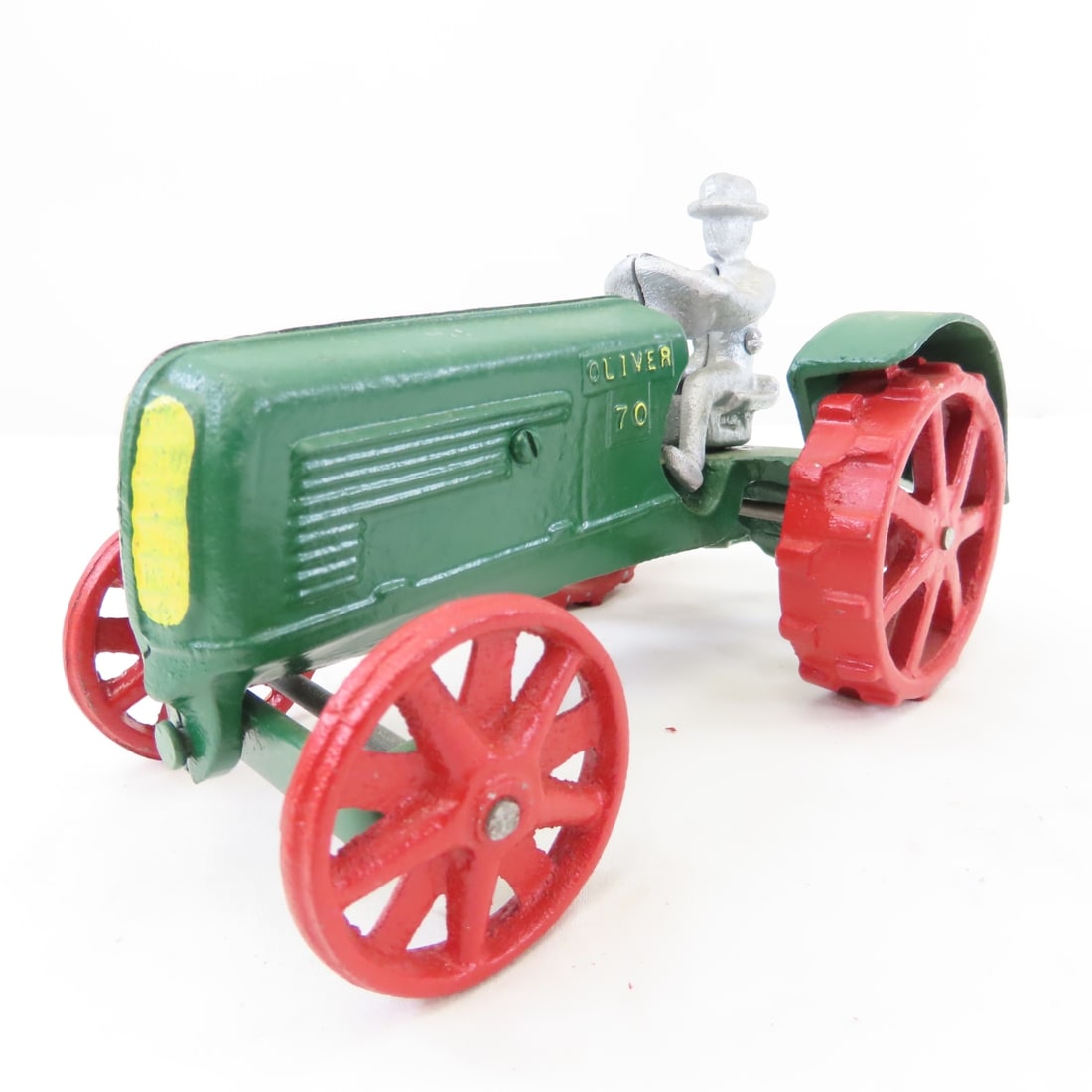 Custom Oliver 70 Row Crop WF Tractor w/ Driver: Custom Oliver 70 Row Crop WF Tractor w/ Driver - looks like a Robert Gray (REG) unmarked, steel wheels, 1/16 cast iron, LOT SIZE: 7x5x5" 2 LBS All information and photos, which are part of the