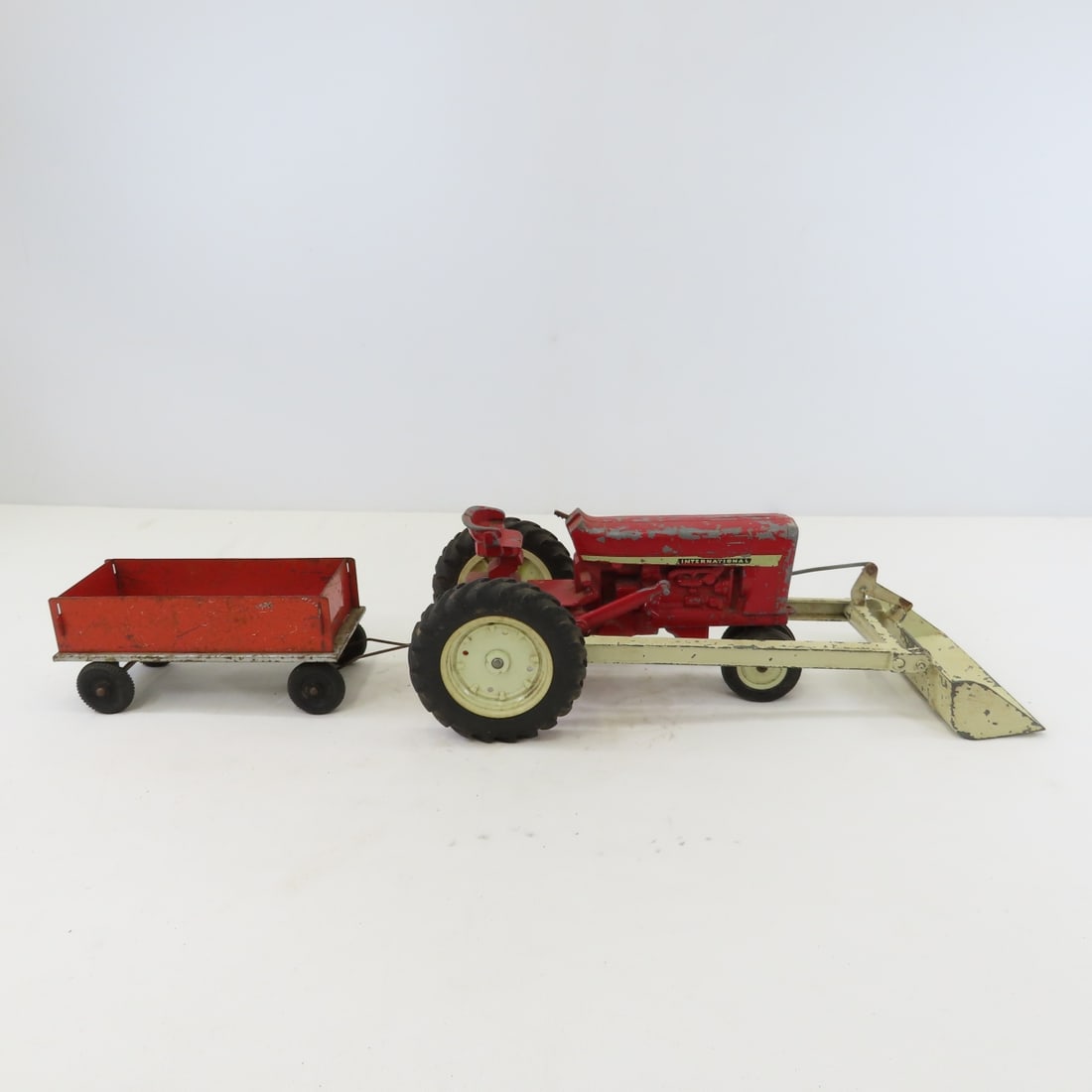 ERTL International Tractor w/loader, plow & cart - 7