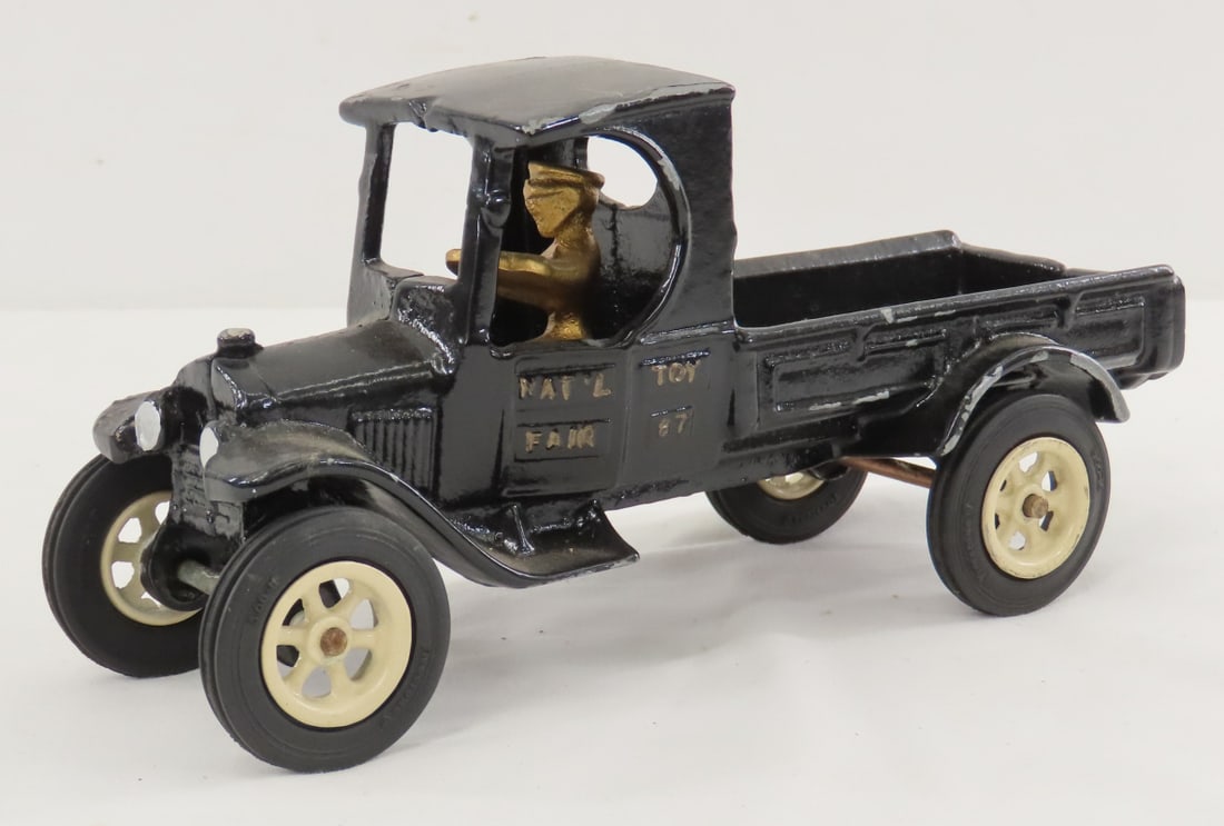Arcade Ford Model T Truck for National Toy Fair 87: Arcade Ford Model T Truck for National Toy Fair 87 - Cast iron truck with driver, Firestone tires, LOT SIZE: 9x4x4" 2 LBS All information and photos, which are part of the description, are intended to