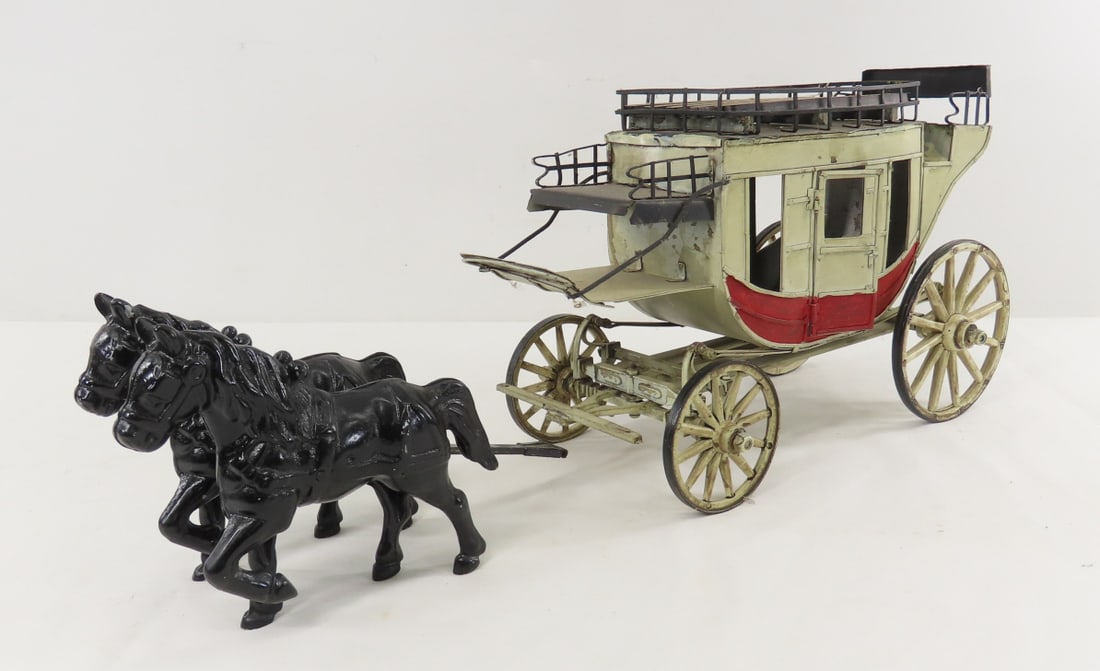 Metal Stage Coach Model with Cast Iron Horses: Metal Stage Coach Model with Cast Iron Horses - not a matched set- stage coach is made in India, horses look to be reproduction. LOT SIZE: 13x9x8" 3.5 LBS All information and photos, which are part