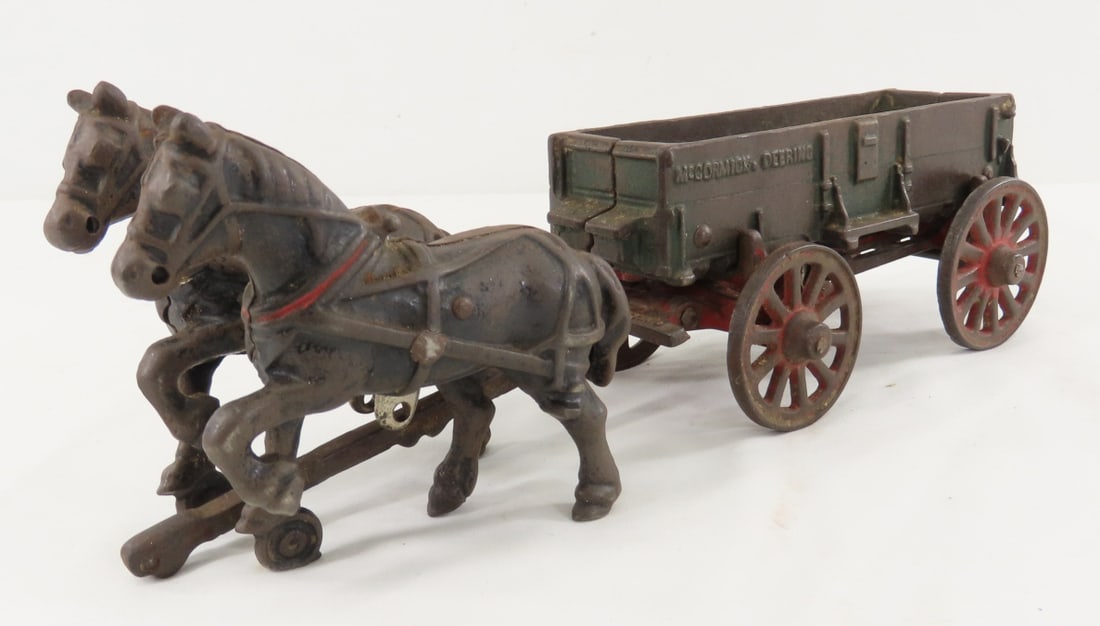 Arcade Cast Iron McCormick-Deering 2 Horse Wagon: Arcade Cast Iron McCormick-Deering 2 Horse Wagon - 1 horse has missing back leg. LOT SIZE: 12x3x5" 4 LBS All information and photos, which are part of the description, are intended to be as accurate