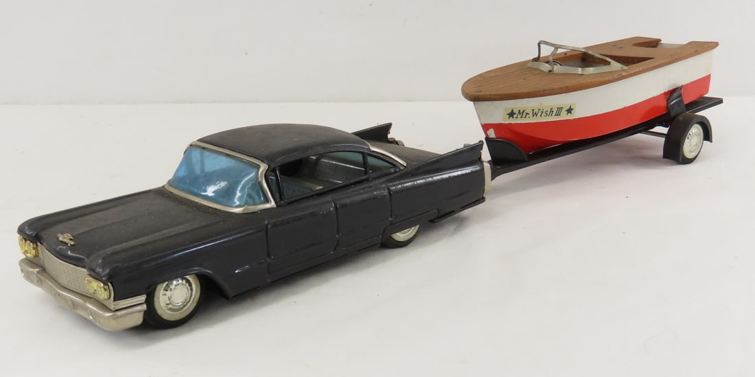 Japan Tin Litho Friction Car & Mr. Wish III Boat: Japan Tin Litho Friction Car & Mr. Wish III Boat - HTC Asahi Japan- boat does not have motor. friction on car works LOT SIZE: 19x6x4" 2 LBS All information and photos, which are part of the
