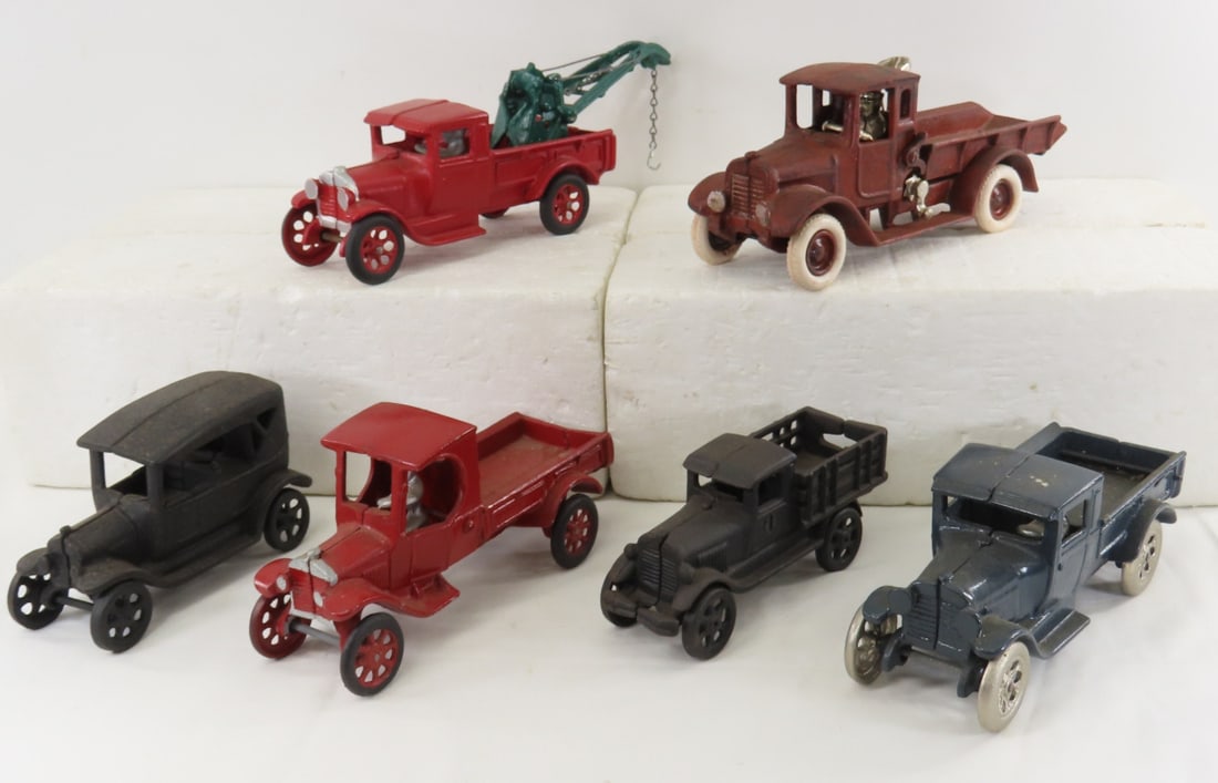 Arcade Repaint & 5 Reproduction Cast Iron Cars: Arcade Repaint & 5 Reproduction Cast Iron Cars - red and green tow truck is a repaint Arcade, one is marked made in China LOT SIZE: 18x14x4" 15 LBS All information and photos, which are part of the