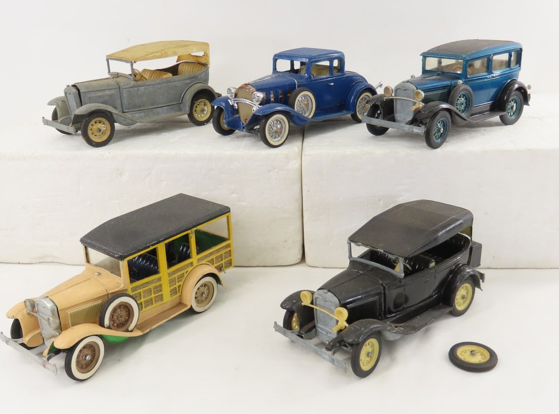 5 Vintage Hubley Ford Model A Sedan & Woody Trucks: 5 Vintage Hubley Ford Model A Sedan & Woody Trucks - some have been repainted and have minor damage. LOT SIZE: 16x11x4" 6 LBS All information and photos, which are part of the description, are