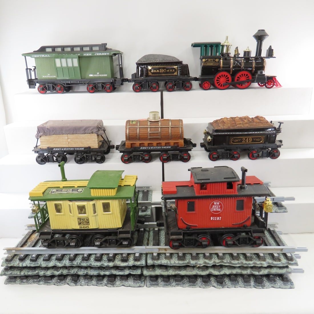 8 Jim Beam Whiskey Train Decanters with Track: 8 Jim Beam Whiskey Train Decanters with Track - 1872 Grant steam engine, CRR 197 of NJ coal tender, 249 wood tender, NJC 21197 caboose, Central RR of NJ baggage car, Jersey & Western whiskey cask,