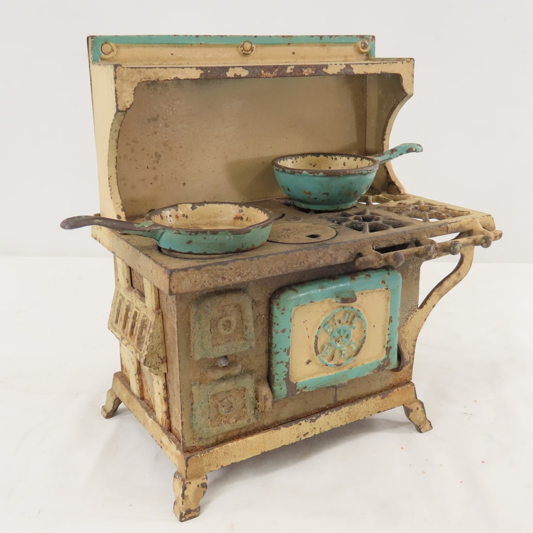 Blue Bird Cast Iron Toy Stove with 8 Burners: Blue Bird Cast Iron Toy Stove with 8 Burners - includes 2 pans, LOT SIZE: 9x5x9" 5 LBS All information and photos, which are part of the description, are intended to be as accurate as possible, but